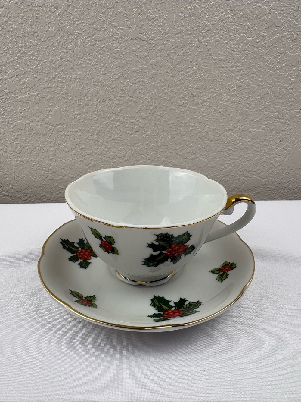 Vintage Lefton Christmas teacup and saucer in the Holly pattern